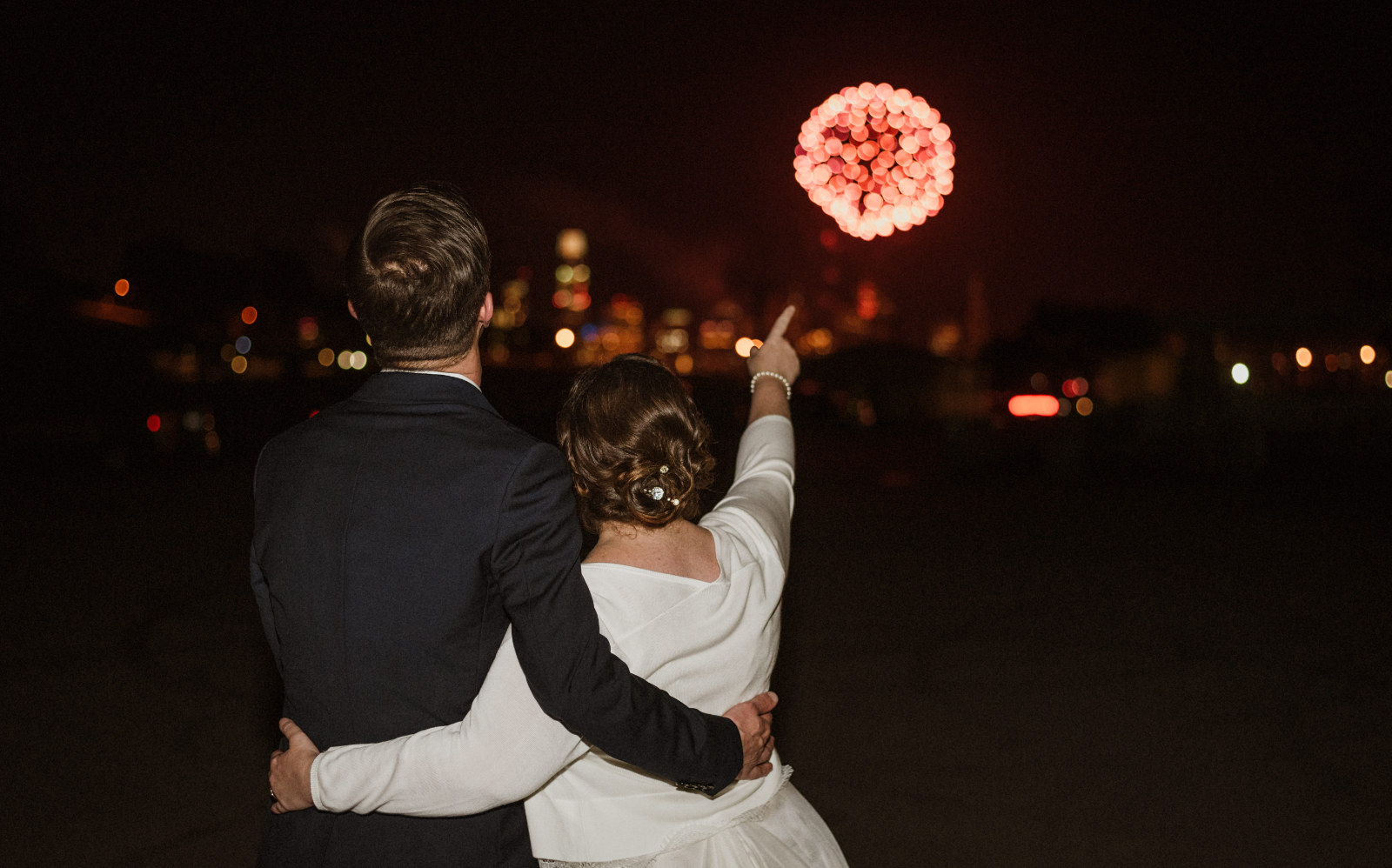 Becca and Christ wedding looking at fireworks.