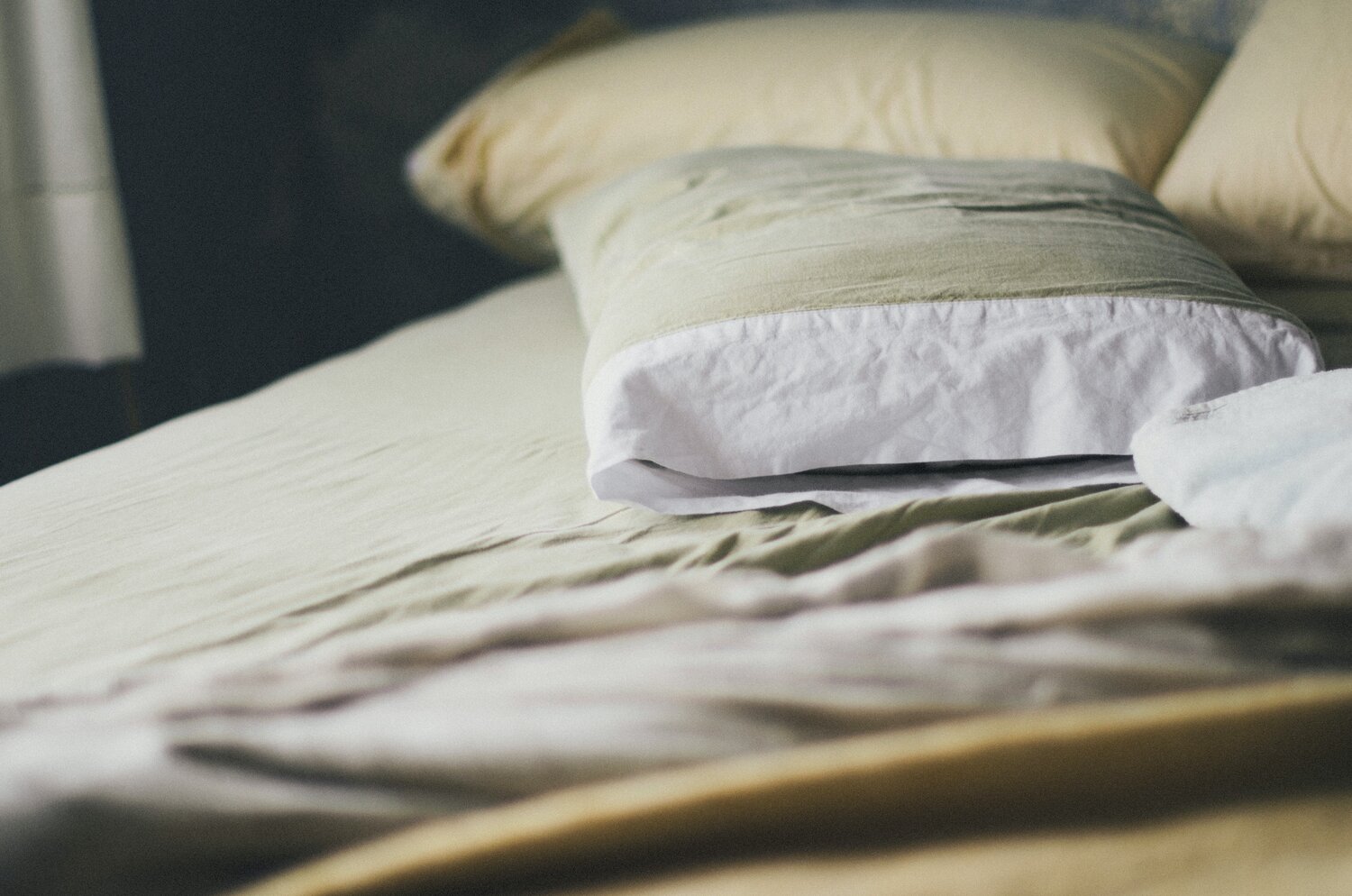 Pillows laying on bed.