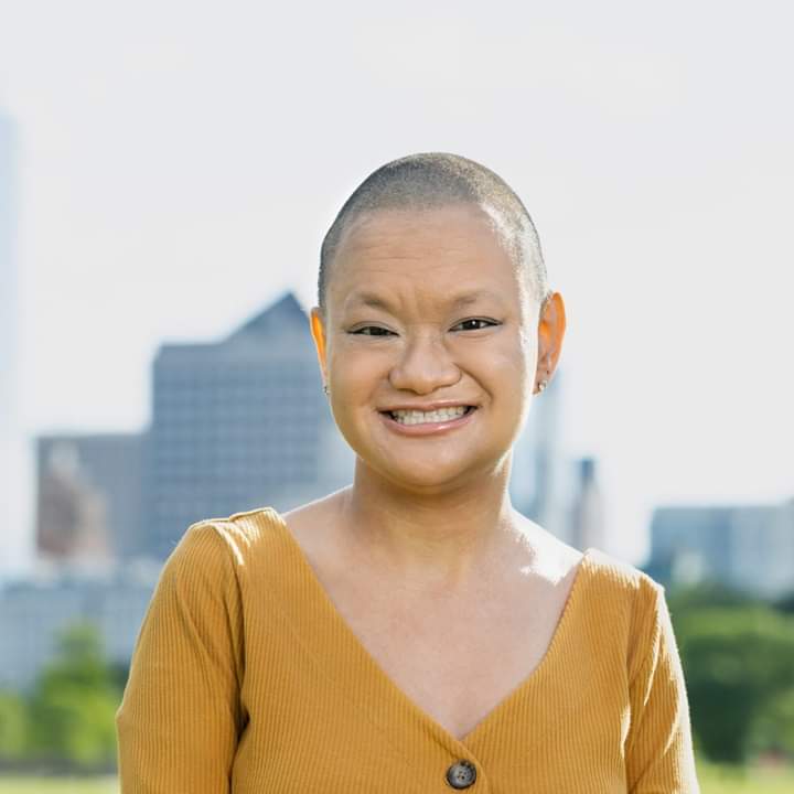 Livia Peterson, story contributor, wearing a mustard yellow top.