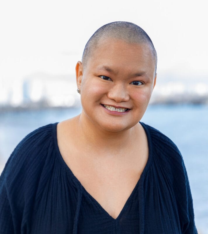 Livia Peterson, story contributor, outdoors with water in background.