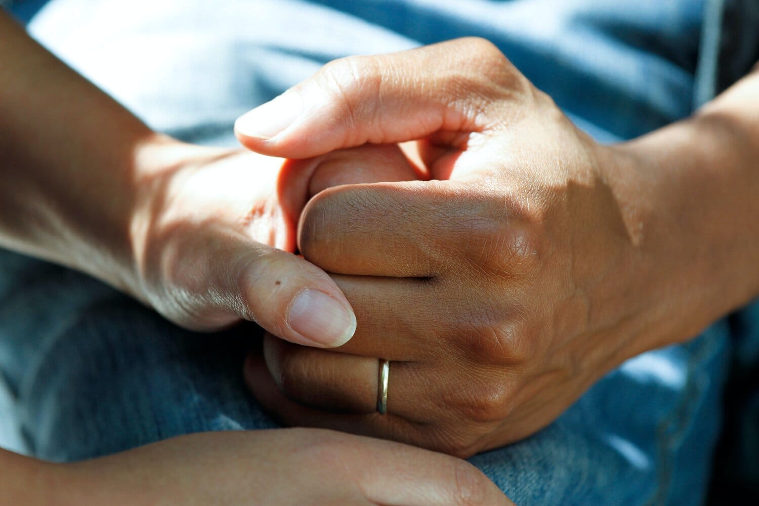 Close-up of two hands being held.