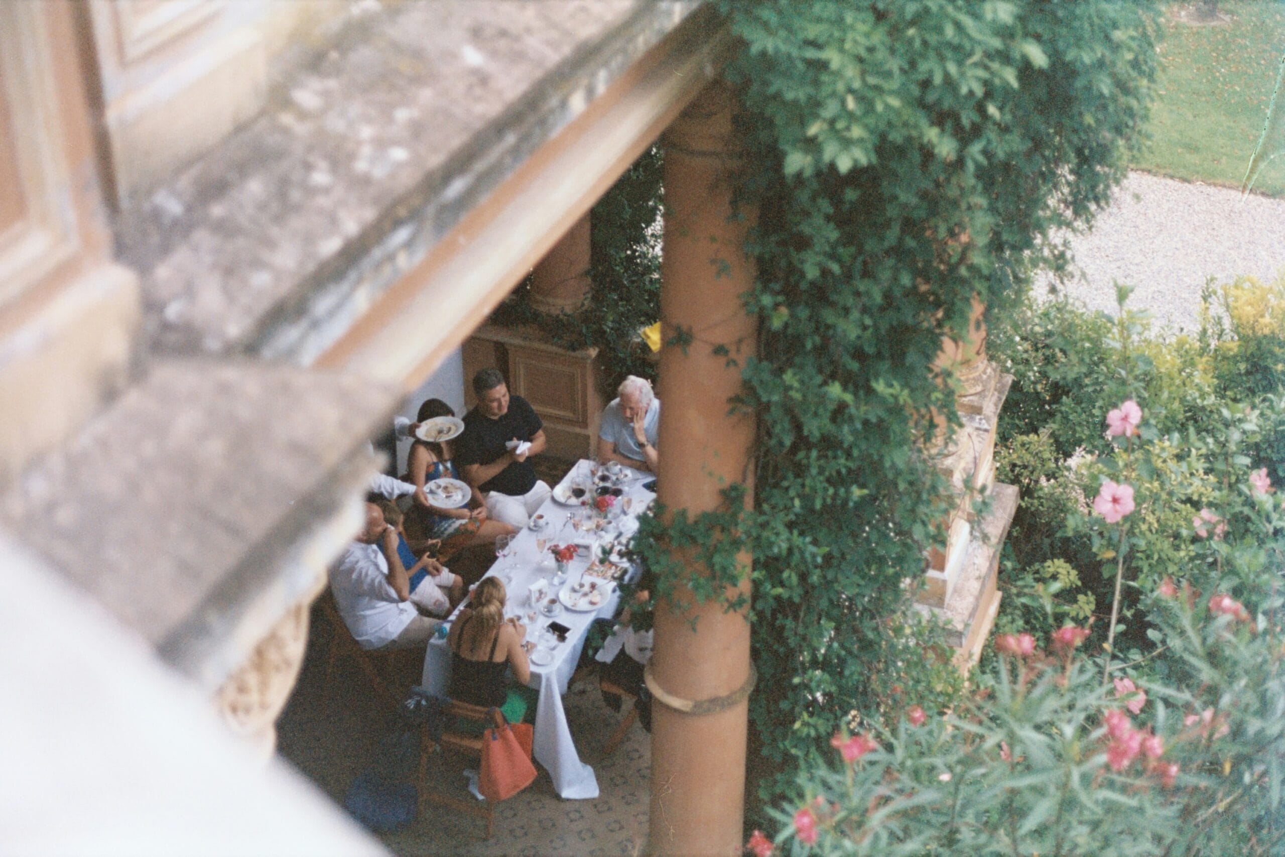 Overhead view of a family gathered outdoors for a meal