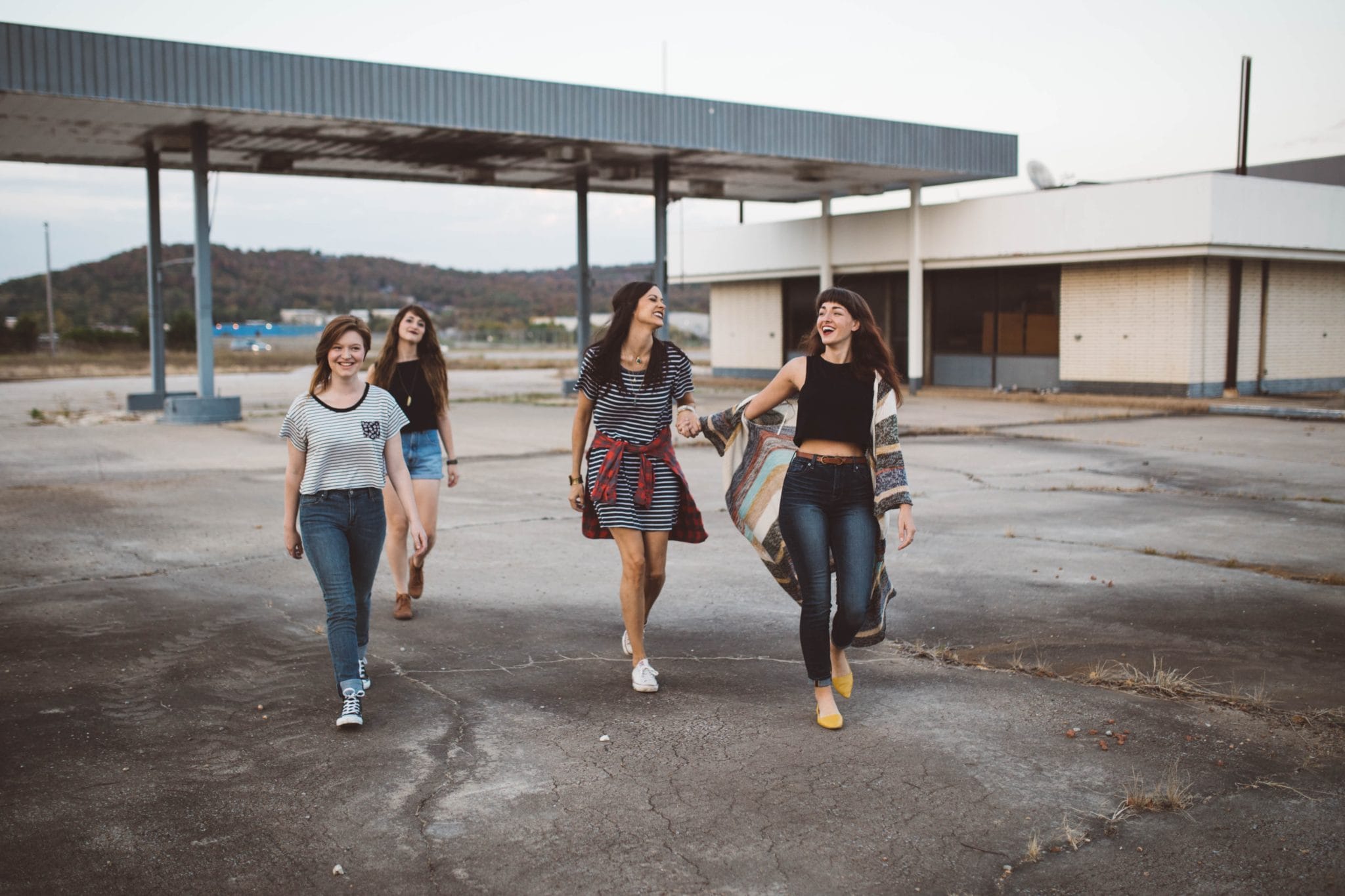 A group of four women hanging out together.
