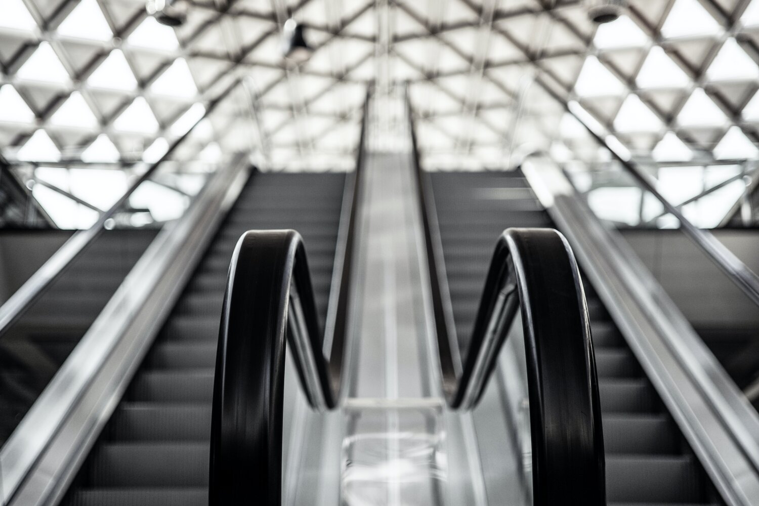 Parallel ascending escalators.