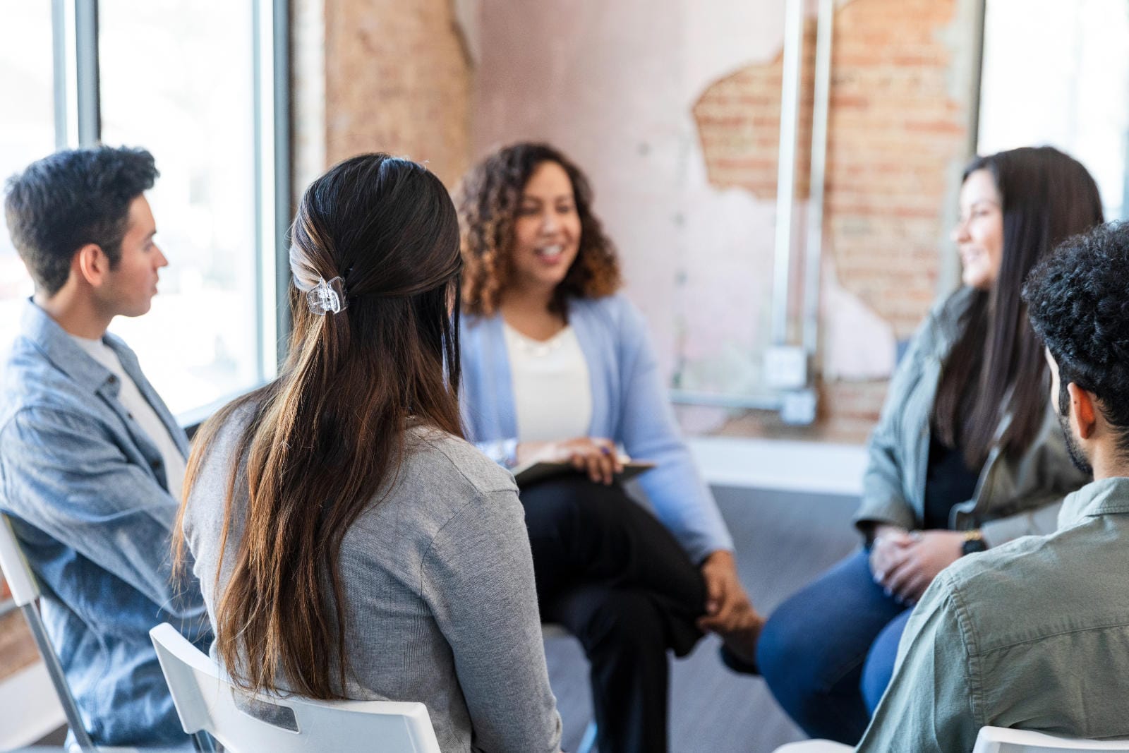 People at an informal support group talking.